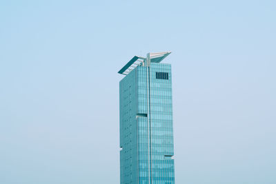 Low angle view of skyscraper against clear sky