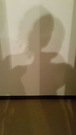 Woman standing on wall