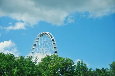 Low angle view of ferris wheel against sky