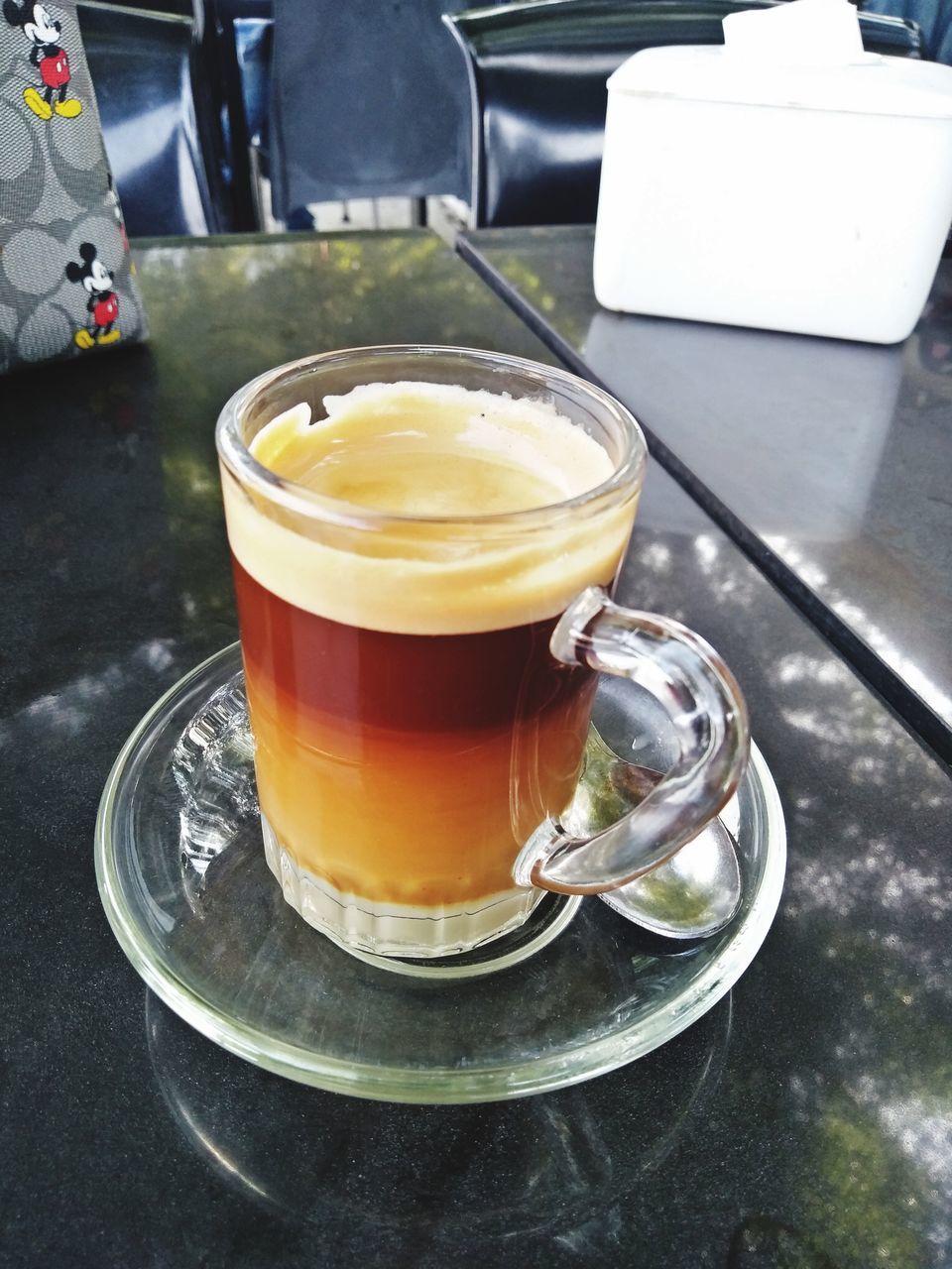 CLOSE-UP OF COFFEE AND JUICE ON TABLE