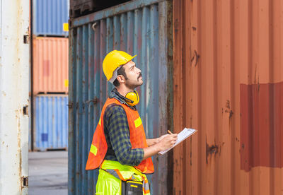 Man working with arms raised