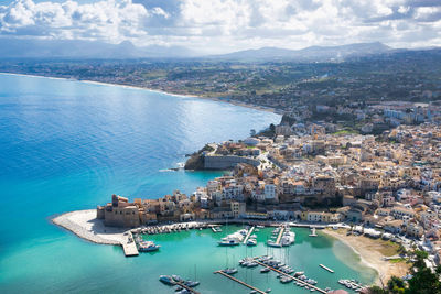 High angle view of city by sea