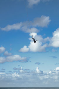 Low angle view of airplane flying in sky