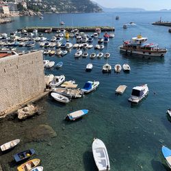 High angle view of boats moored at harbor