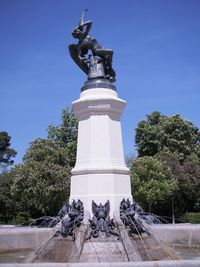 Low angle view of statue against sky