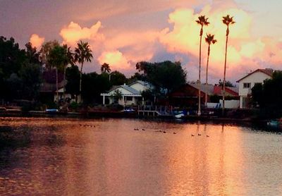 Scenic view of river at sunset