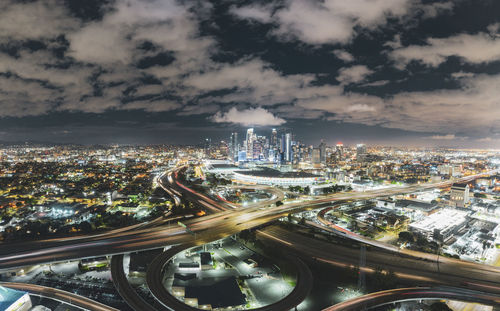 High angle view of illuminated cityscape against sky