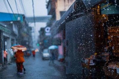 Wet street in city during winter