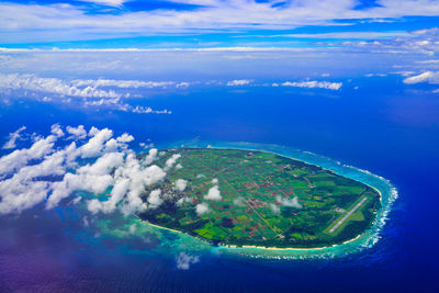 Aerial view of sea and landscape against sky