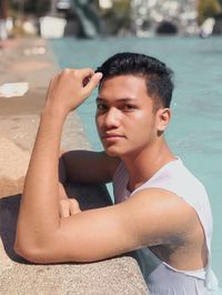 Portrait of young woman sitting outdoors