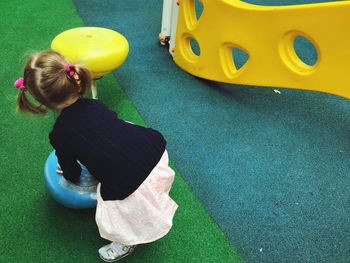 High angle view of girl playing in playground