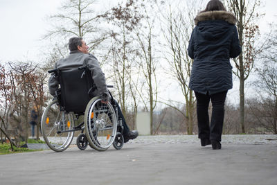 Rear view of man walking on street
