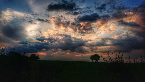 Scenic view of landscape against cloudy sky