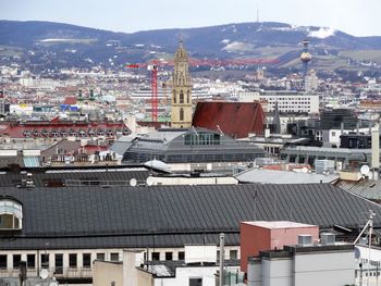 High angle view of illuminated buildings in town against sky