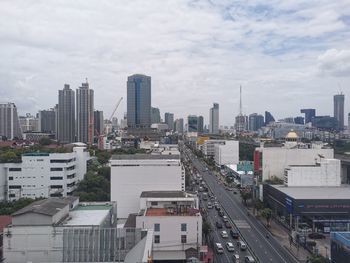 High angle view of buildings in city against sky