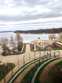 High angle view of park by lake against sky