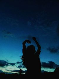 Silhouette man against sky at night