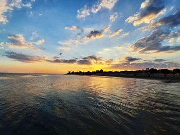 Scenic view of sea against sky at sunset