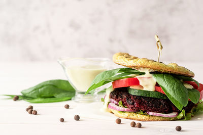 Fresh homemade veggie burger with beetroot cutlet and vegetables