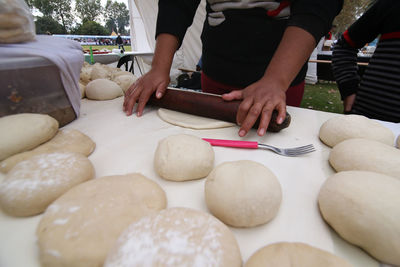 Midsection of man preparing food at table