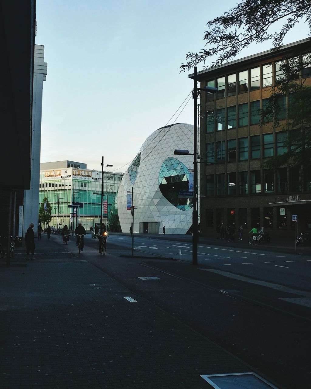 VIEW OF CITY STREET WITH BUILDINGS