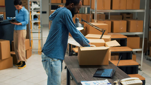Rear view of man working in office