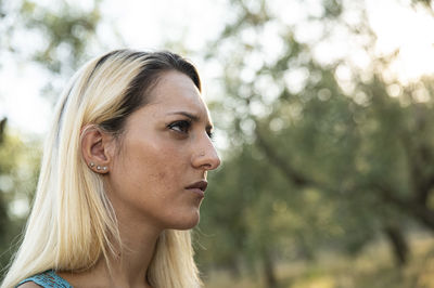 Close-up of young woman looking away