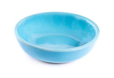 High angle view of blue glass on white background
