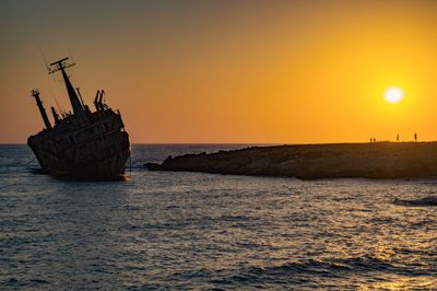 Scenic view of sea against clear sky during sunset