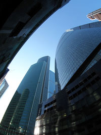 Low angle view of modern buildings against sky