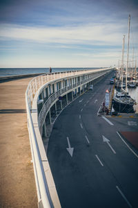 Road by sea against sky