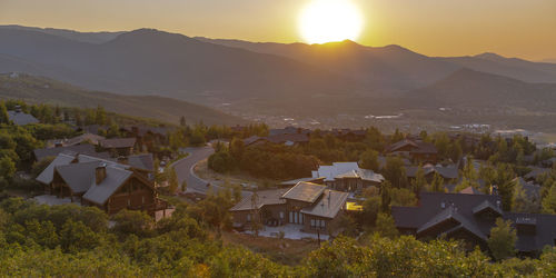 High angle view of townscape and mountains against sky