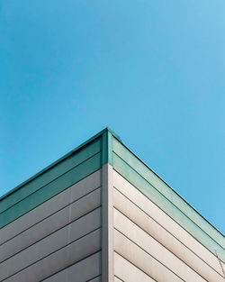 Low angle view of building against clear blue sky