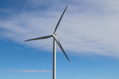 Low angle view of wind turbine against sky