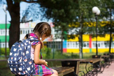 Side view of girl looking outdoors