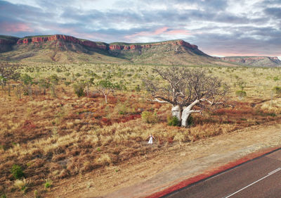 View of road amidst landscape against sky