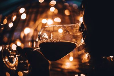 Close-up of man holding wine glass