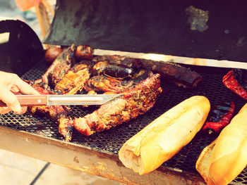 High angle view of meat on barbecue grill