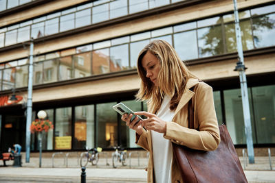 Young woman using mobile phone