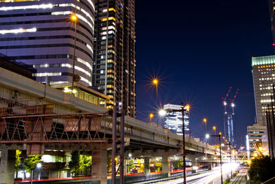 Illuminated buildings in city at night