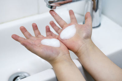 Midsection of woman in bathroom