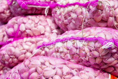 Close-up of garlic cloves sack