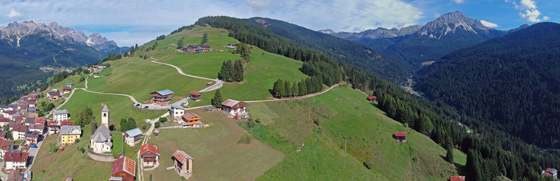 High angle view of land and mountains against sky