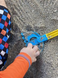 Low section of person holding umbrella