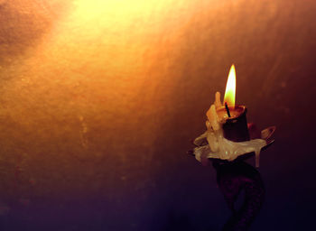 Close-up of lit candle