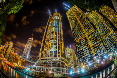 Illuminated buildings in city at night