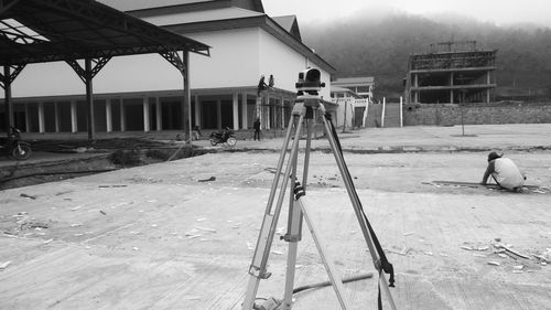 People working on construction site by building