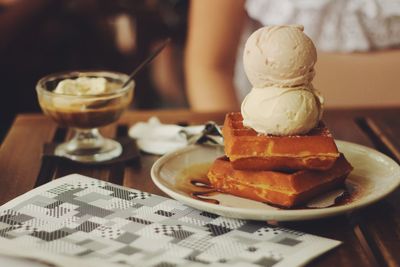 Close-up of waffle ice cream stack served in plate