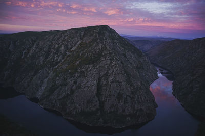 Scenic view of rock formation against sky during sunset