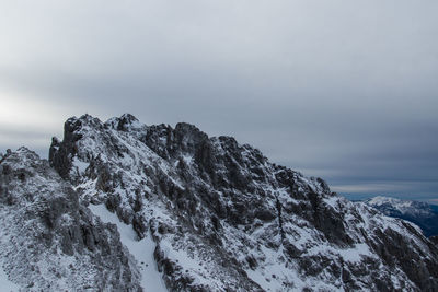 Scenic view of mountains against sky during winter